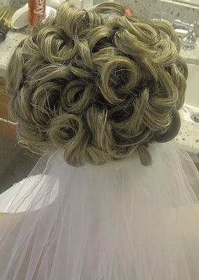 brides wedding day we decided on larger curls than the next photos in the trial run