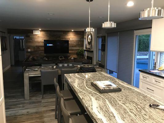 Contemporary kitchen and stressed wood wall.