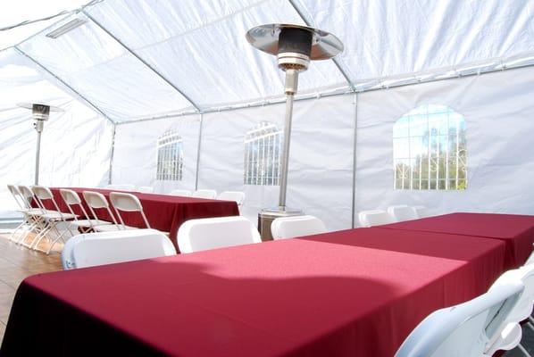 Elegant tents and canopies with windows, custom linens and space heaters.