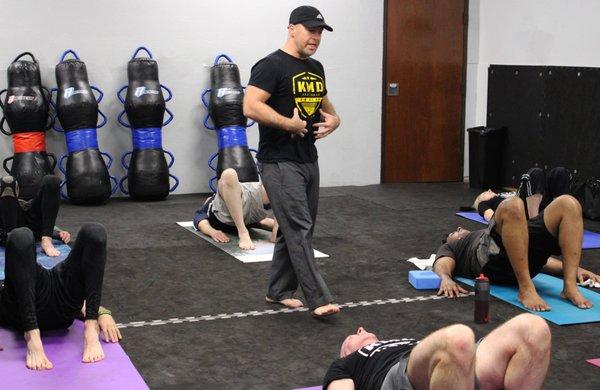 An instructor explaining the importance of core strength in one of our yoga classes.