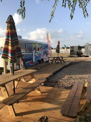 View from one of the THREE picnic tables on an actual deck to keep you out and off the heat!