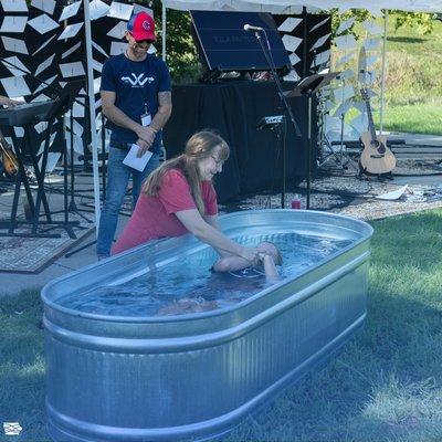 Ella Patterson being baptized by Jennifer Holeman in Centennial Park.