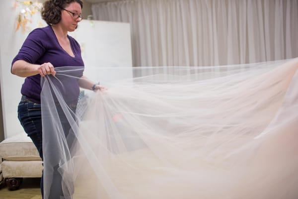 Christina looking at the skirt of a custom build.