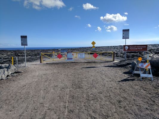 The barricade at the end. It's a quick walk to see the lava flowing into the ocean, and about a 2 mile rough hike to see the lava up close.