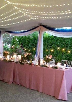 Tent reception head table at the Great Lakes Culinary Center in Southfield, Michigan