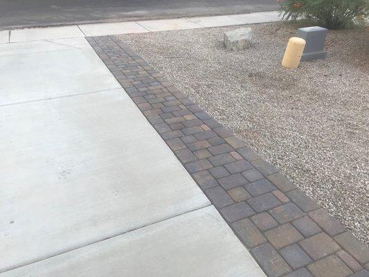 Extended the driveway to  keep people from ending up in the grass when they exit the car.