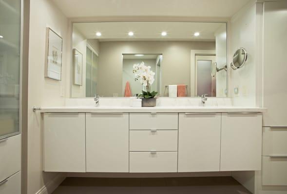 White painted contemporary cabinetry for a bathroom condo in downtown Madison.