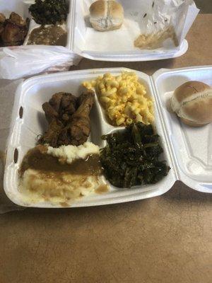 Fried Chicken with mac & cheese, collard greens and mashed potatoes.