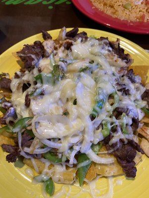 Steak, Chicken, Shrimp, Onions, Green Peppers and Tortilla chips with cheese