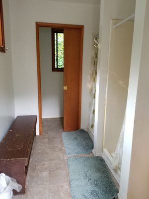 Inside main bath house (2 showers with 1 sink and 1 toilet)