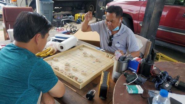 Customers playing chess while waiting.