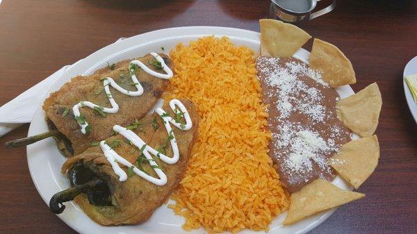 Chili rellenos with rice and refried beans