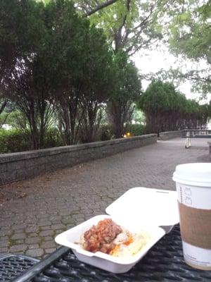 Eggs with sausage gravy and potato with corned beef from the breakfast bar at one of the picnic tables outside of the cafeteria.