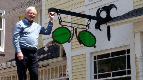 Dr. Reyburn and the antique glasses on the Ada Drive side of our office.