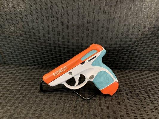 Cerakote Taurus Spectrum with Miami dolphins colors .