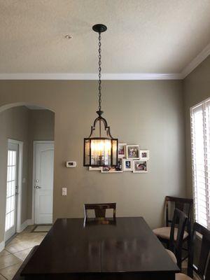 Replaced kitchen nook light with a new chandelier.