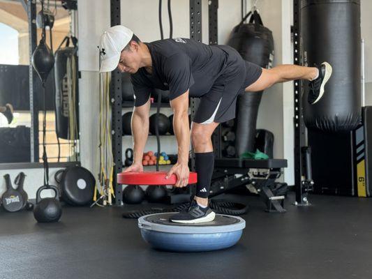 RDLs on a Bosu ball mimic real-life movements that require stability and balance