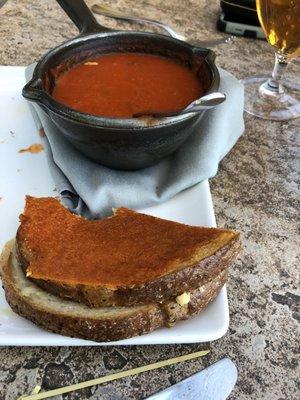 Tomato soup and grilled cheese (already ate half the sandwich)