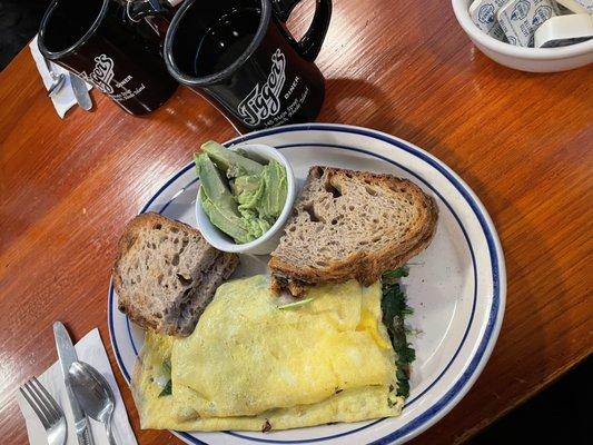 Omelette with spinach, roasted red peppers and onions, rye toast and avocado for the toast!  And coffee!