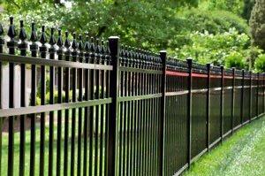 Black aluminum fence with Quad finials