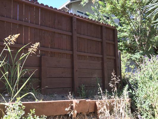 Retaining wall and fence combination