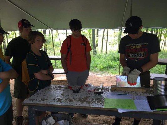 Scouts taking the metalworking merit badge at Camp Frontier.