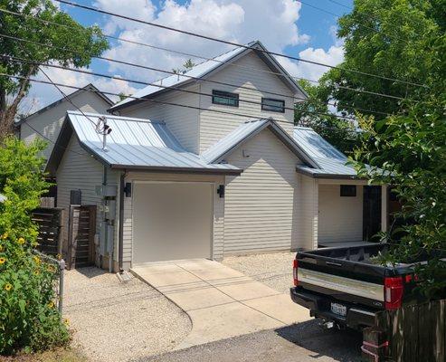 24 gauge 1.5-inch Galvalume standing seam metal roof with "Surelock" interlocking panels. Replaced asphalt shingles destroyed in hailstorm.