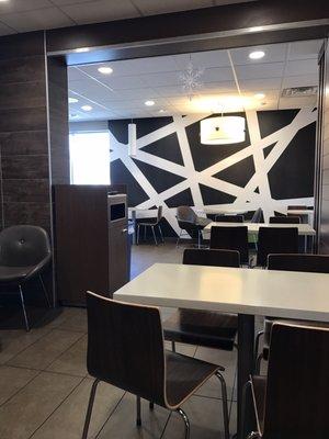 Inside McDonald's Lakehurst. More modern furniture and graphic design walls in hues of black, white and gray no bright red, yellow and blue