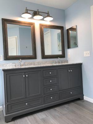 Updated master vanity, lighting and LVT flooring.