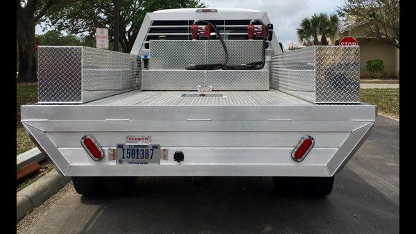 Custom fabricated aluminum flatbed and aluminum diamond plate tool boxes.