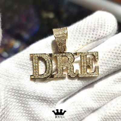 Custom name , "DRE", in diamonds and gold .  #ryusjewelry #customnameplate