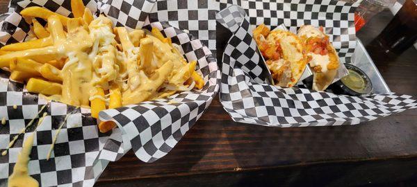 Fries and off the hook tacos one with shrimp the other with fried catfish