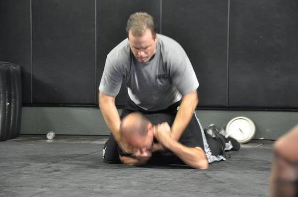 Eyal (on the bottom) getting ready to show how to defend against a choke with someone on your back (Brian Peters - Co-Owner)