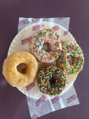 Strawberry frosted sprinkle chocolate frosted sprinkle vanilla frosted sprinkle and the glaze doughnut so good