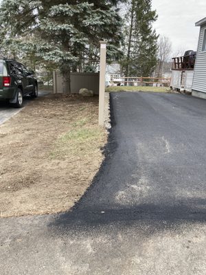 Clearly paved neighbors property.