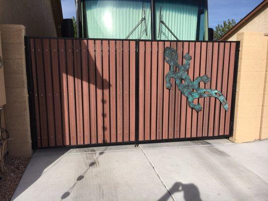 RV gate with synthetic redwood pickets.