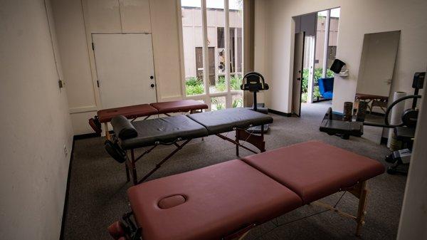 training tables and space dedicated to mobility and stretching work with clients