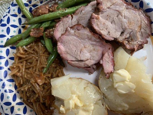 Grilled teriyaki pork loin, teriyaki rice, grilled baked potatoes, sautéed string beans with bacon.