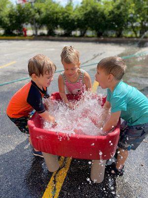 Active Childcare. Come see what our daycare has to offer. Kids having a blast during water play