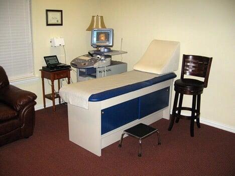 We have a very comfortable exam table with a soft therapeutic pillow for your back and head.