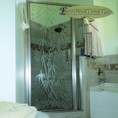 Shower door with custom etched glass design. Bamboo on shower door