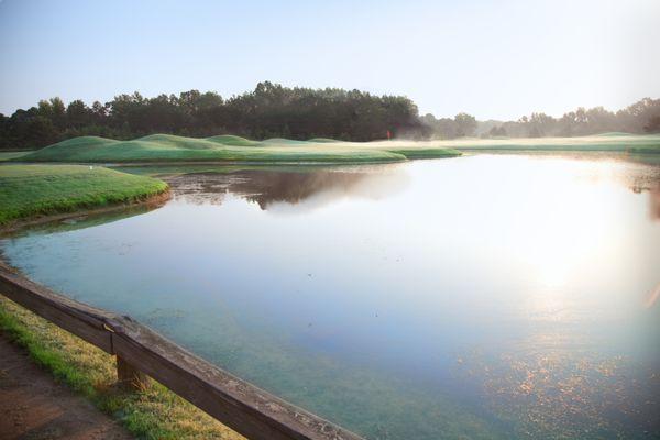 Looking back from the tee box on 8 to the green on 7. This pond is the source for all course irrigation and no one knows how deep it is.