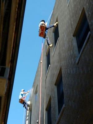 Sealcoating / waterproofing  concrete  split face  cinder block wall