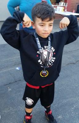 Our son representing dog pound wrestling at one of his tournaments