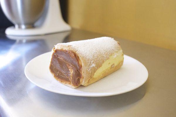 Sweet vanilla cake roll filled with dulce de leche (caramel). (Contains: Milk, Wheat)