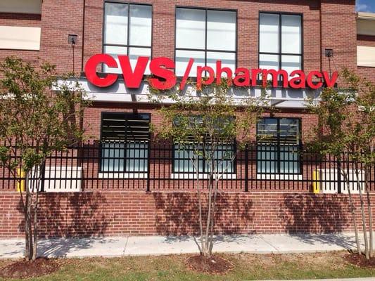 Custom architect specified ornamental steel fence set in brick at CVS