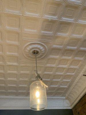 Beautiful example of early 20th Century stamped metal ceiling work.