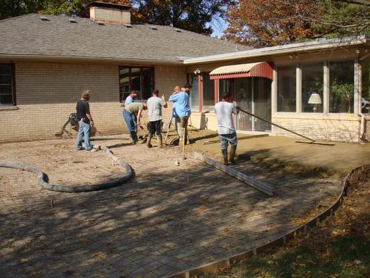 Using a pump to pour concrete saves your yard from being torn up.