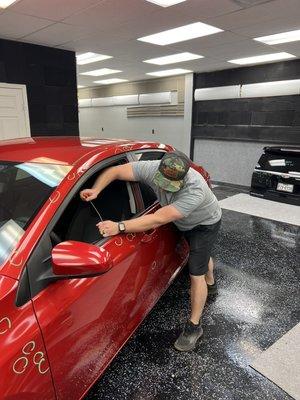 Kyle performing Paintless dent repair