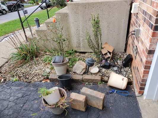 Tons of trash and debris left at our front steps, wiring left out and exposed to elements